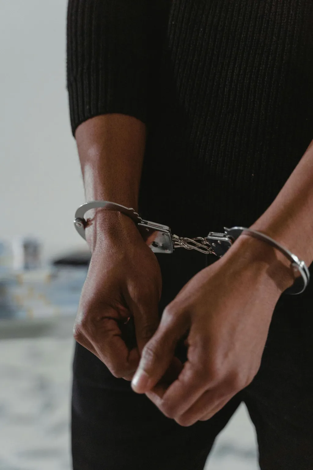 Man in handcuffs after an arrest in Illinois